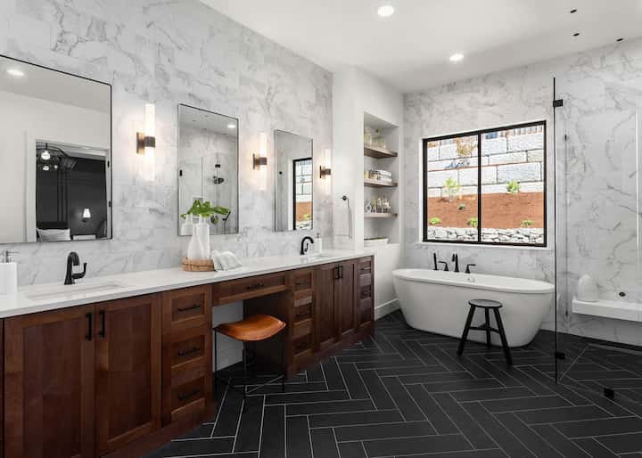 Creative floor tile designs add beauty to a modern Augusta, GA bathroom.